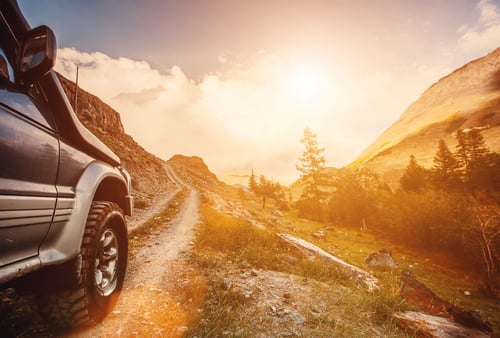 Black Chevrolet pickup truck parked on rocky terrain