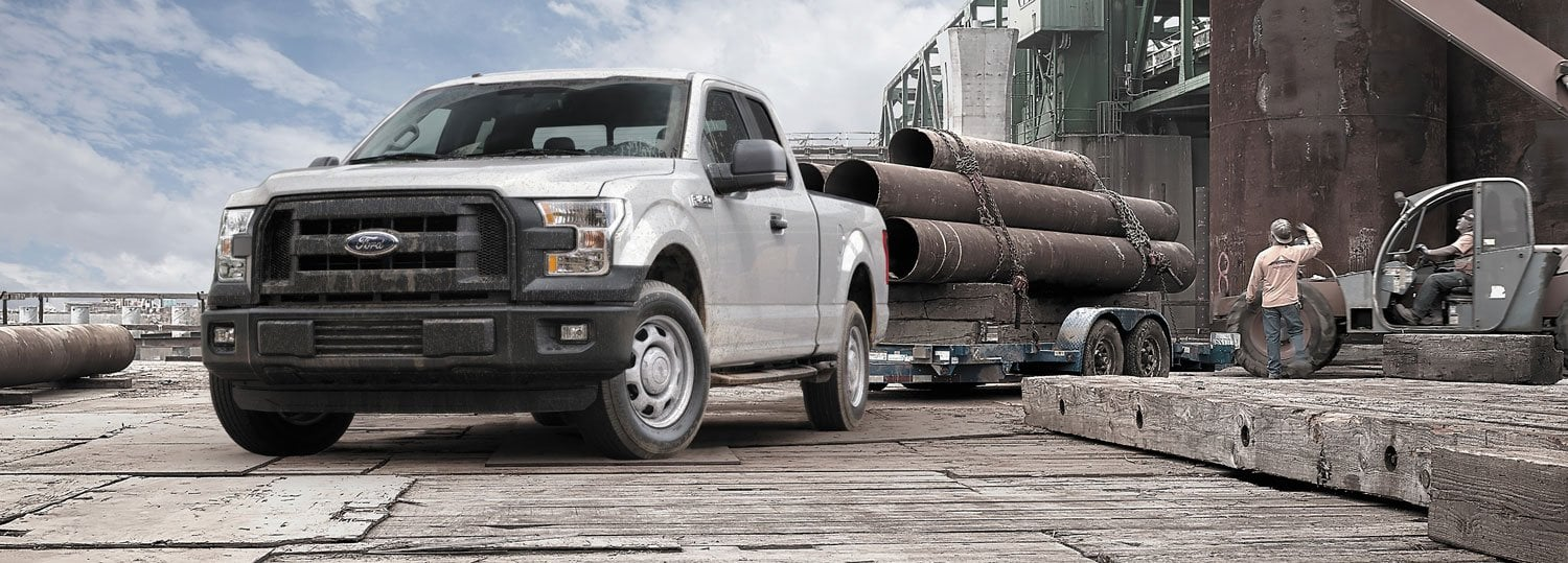 A light gray Ford F-150 pickup truck 