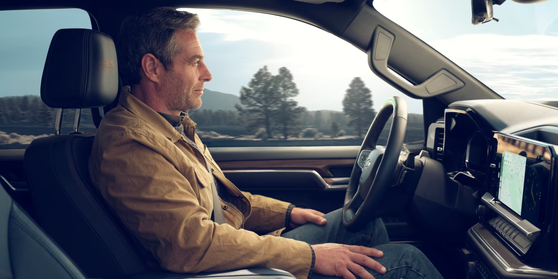 A man is driving the car.