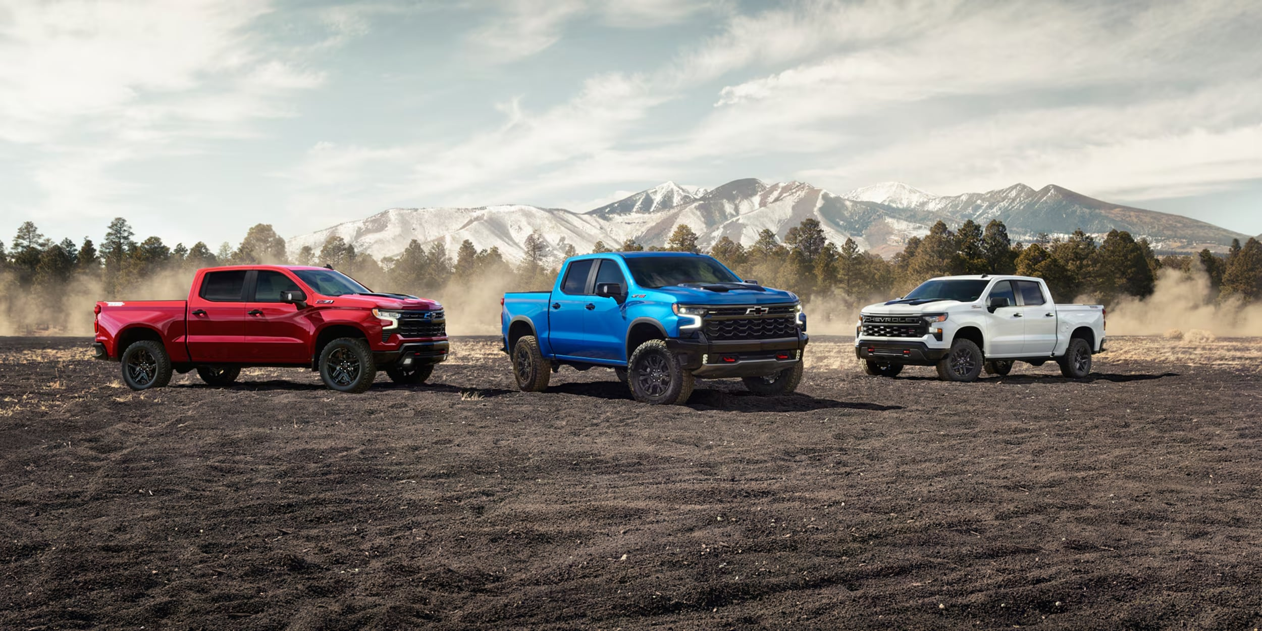 Red, Blue, White Silverado 1500 is parked