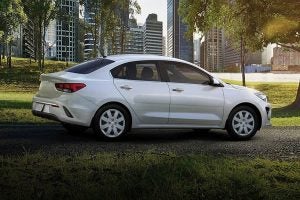 Kia Rio driving in a park near Orangeburg, SC