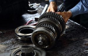 A person servicing a car's transmission near Orangeburg, South Carolina