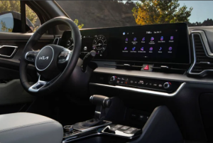 The front dashboard and front touch screen that make up a Kia Sportage's infotainment system. Photo taken near Orangeburg, South Carolina