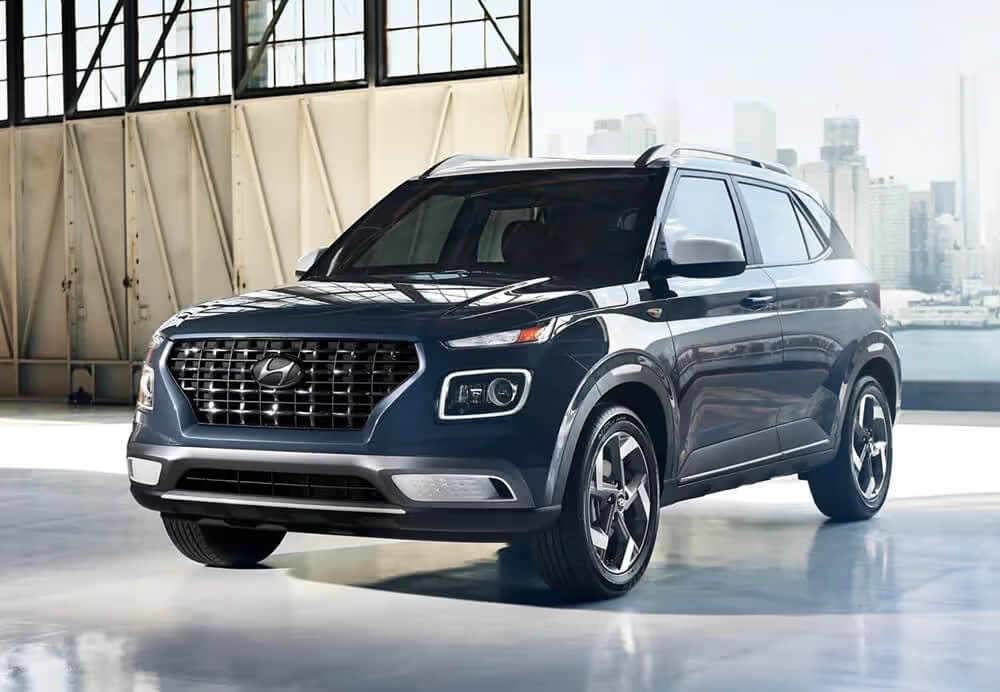 Hyundai Venue cargo area packed neatly with luggage boxes and everyday items