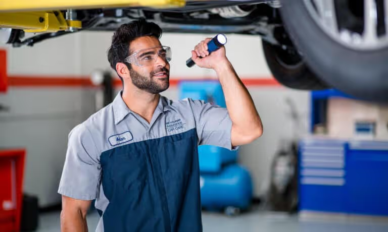 Hyundai service technician performing maintenance at McCarthy Hyundai of Lawrence KS