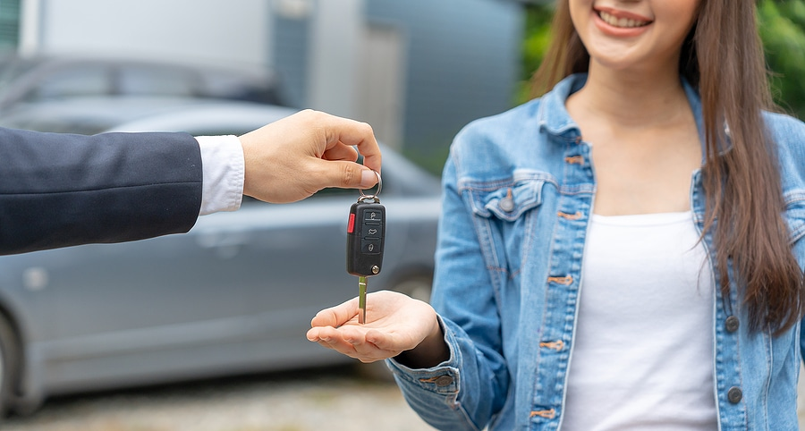 First-time car buyer getting keys at McCarthy Hyundai of Lawrence KS