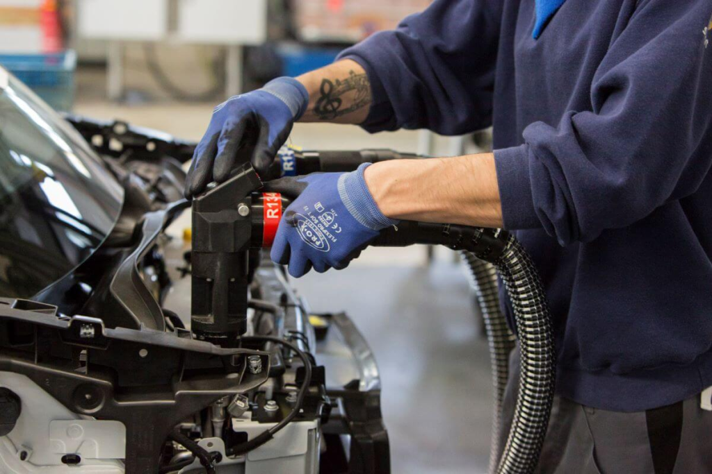 Hyundai certified technician checking brake fluid at McCarthy Hyundai of Lawrence KS