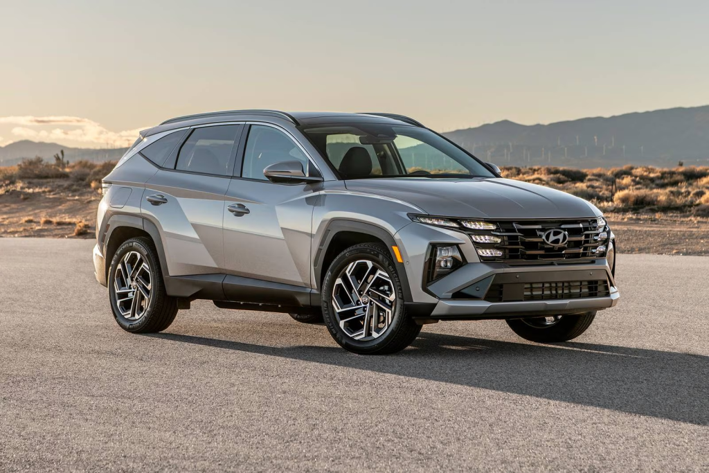 2025 Hyundai Tucson Plug-in Hybrid driving near Topeka KS with fuel-saving PHEV technology