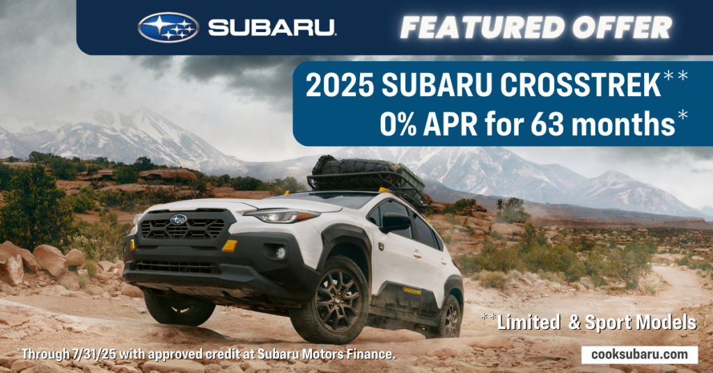 2025 Subaru Crosstrek ad: White SUV with roof rack driving off-road in a desert landscape with mountains.