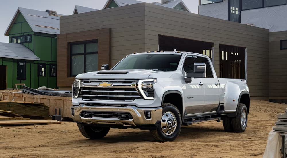 White 2026 Chevy Silverado 2500 HD parked in a construction site.