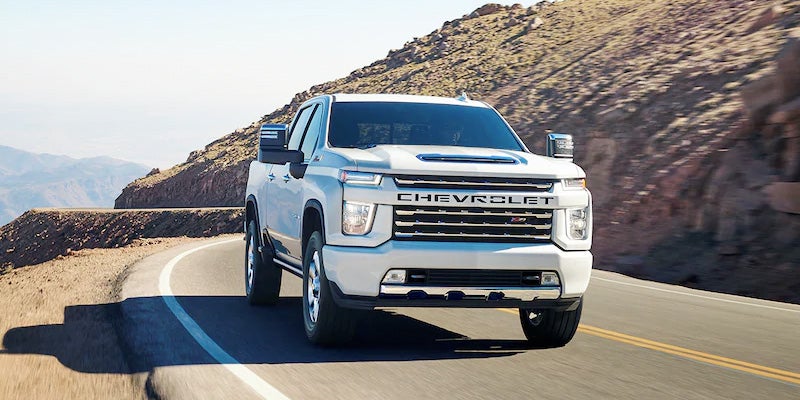 Chevrolet Silverado 2500 driving on road.