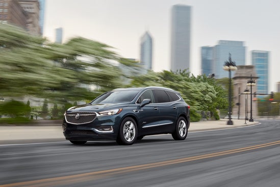 2021 Buick Enclave driving on road.
