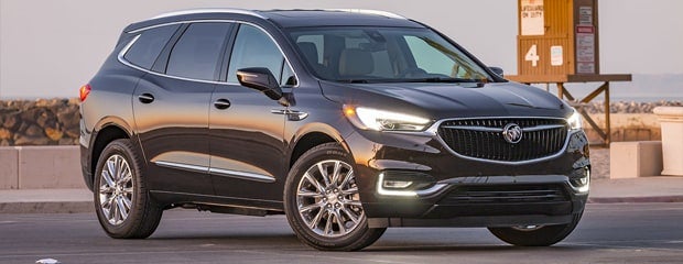 Buick Enclave Avenir parked outside.
