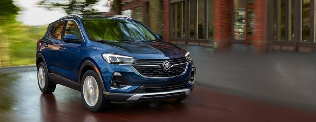 Buick Encore GX driving on road.
