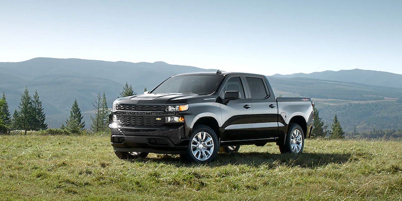 Chevy Silverado-1500 parked on grass.