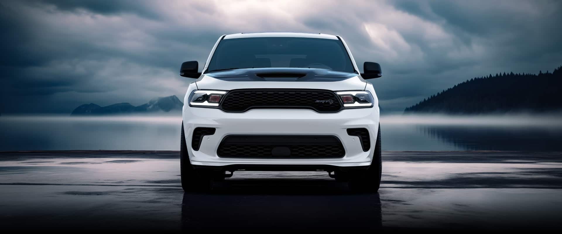 White 2026 Dodge Durango SRT Hellcat parked beside a lake under a cloudy sky, a Durango for Bowie, TX drivers