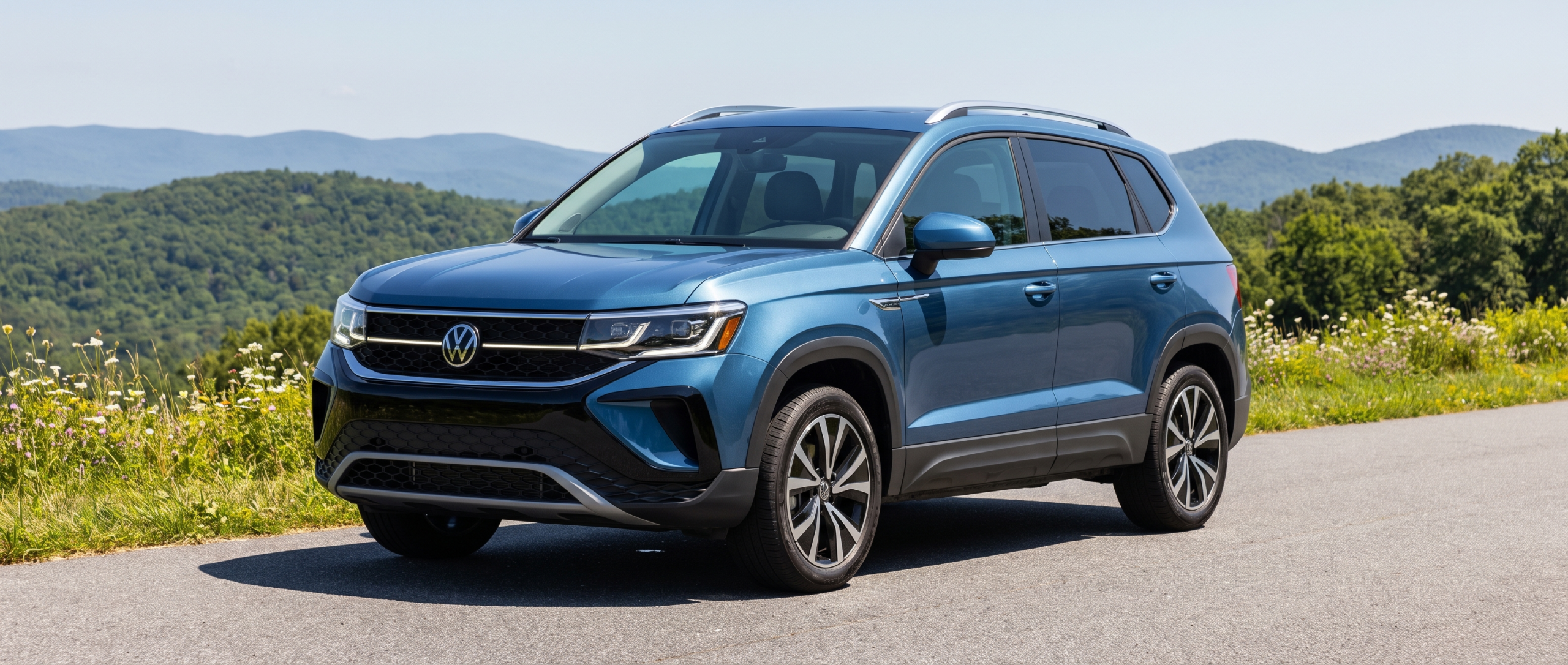 2026 Volkswagen Taos on a South Carolina scenic highway with Blue Ridge foothills in the background