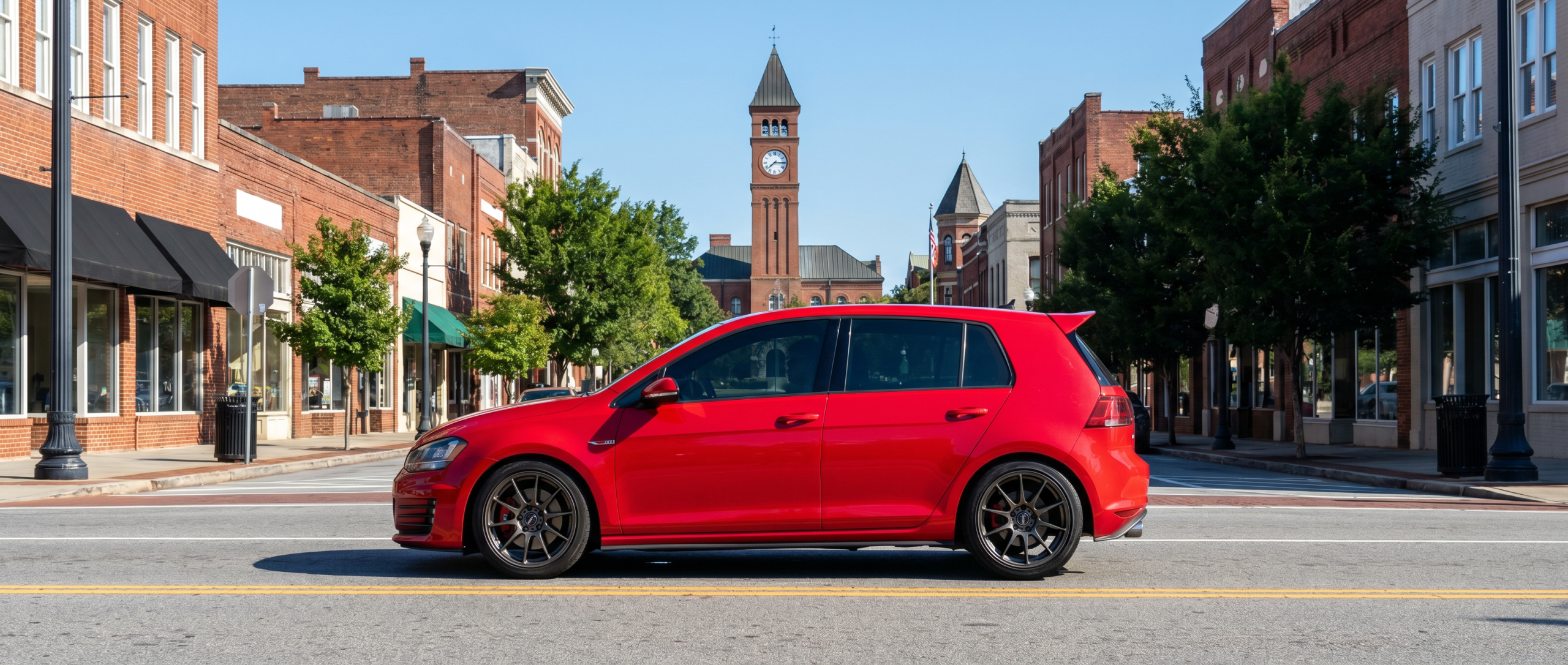 Volkswagen Golf GTI performance hatchback driving through Spartanburg SC streets