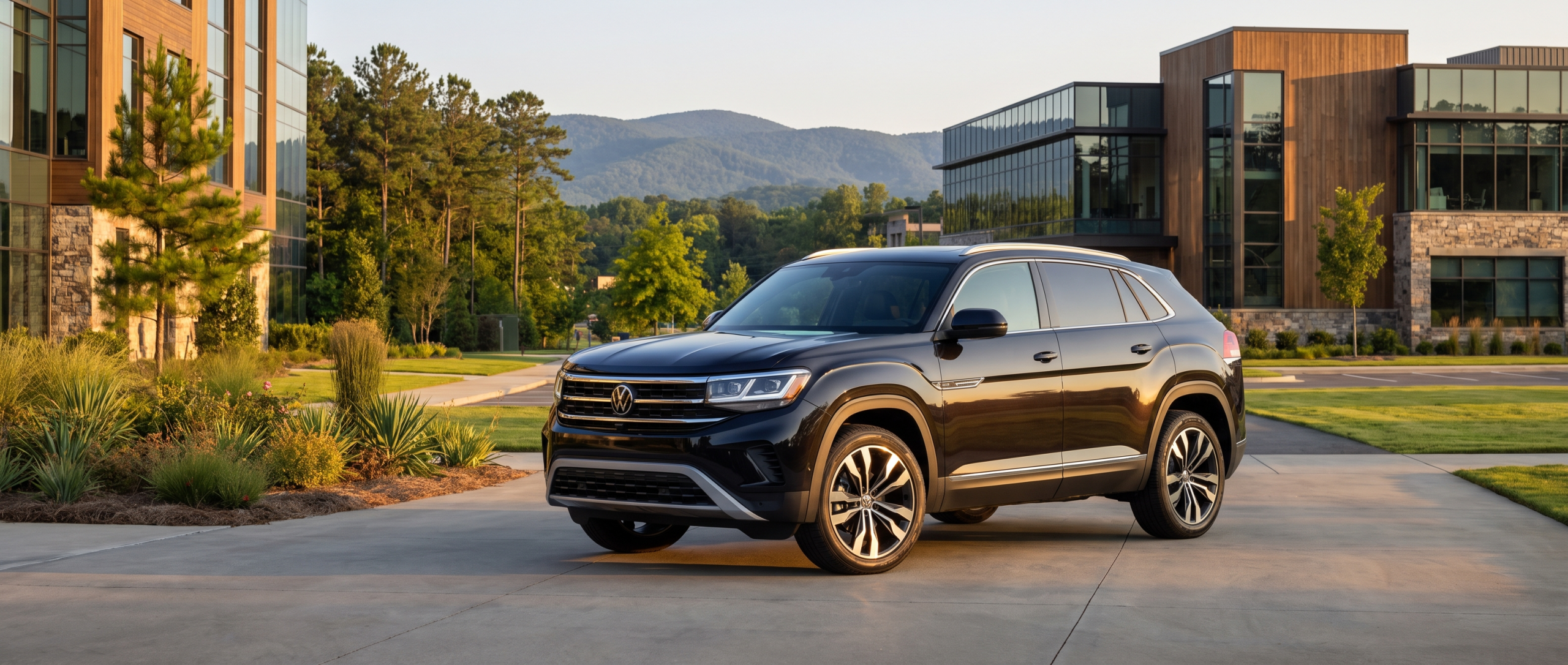 2026 Volkswagen Atlas Cross Sport in Deep Black Pearl at an Upstate South Carolina office park with Blue Ridge foothills in the background