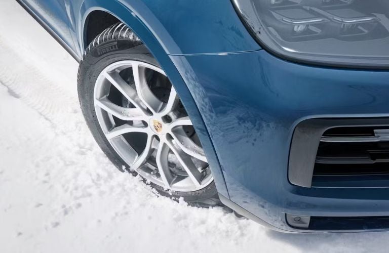 image of a Porsche tire in snow