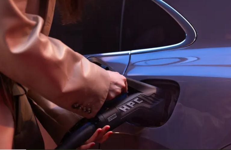 close up image of a Porsche being charged