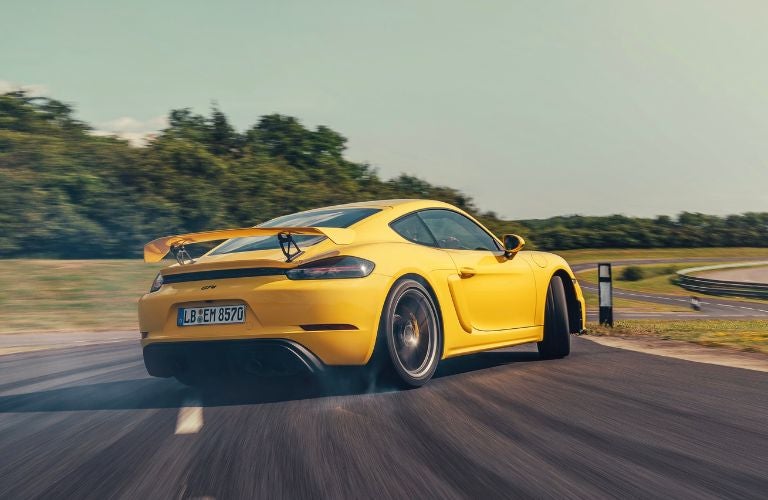 yellow Porsche 718 GT4 