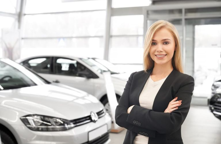 Woman posing with the vehicles