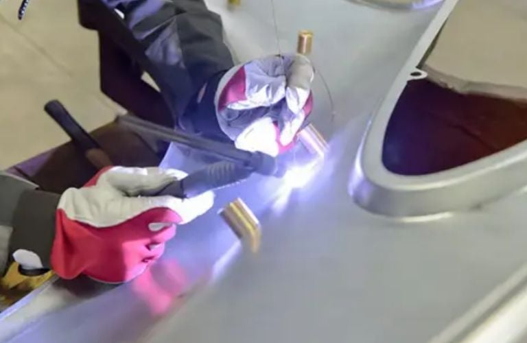 a technician working on a Porsche part/accessory