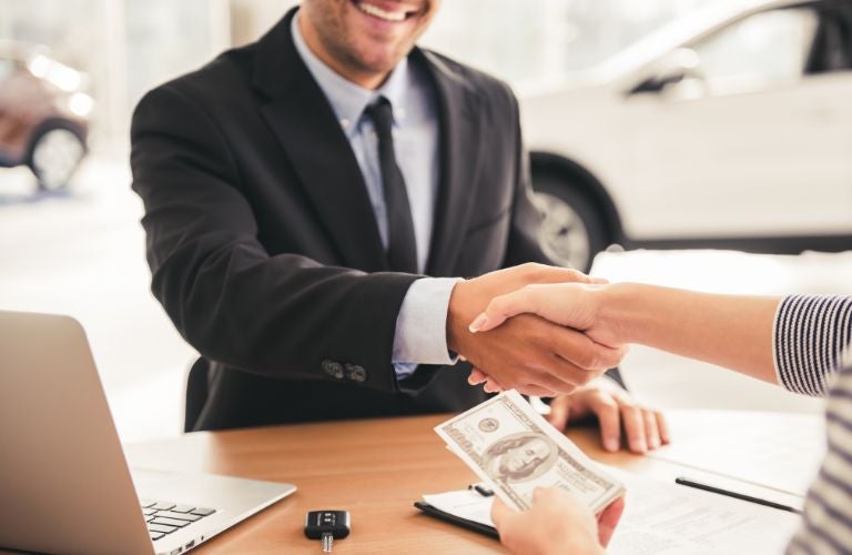 Sales person shaking hand with a client