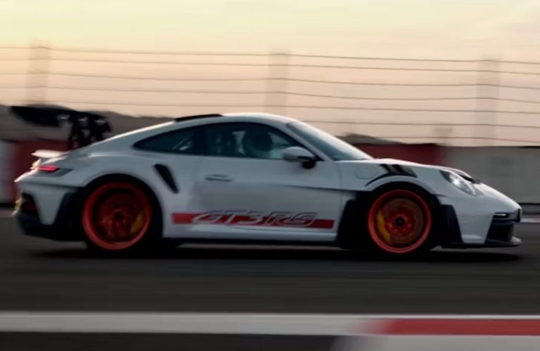 side view of a Porsche on a track