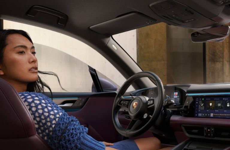a woman driver in Porsche