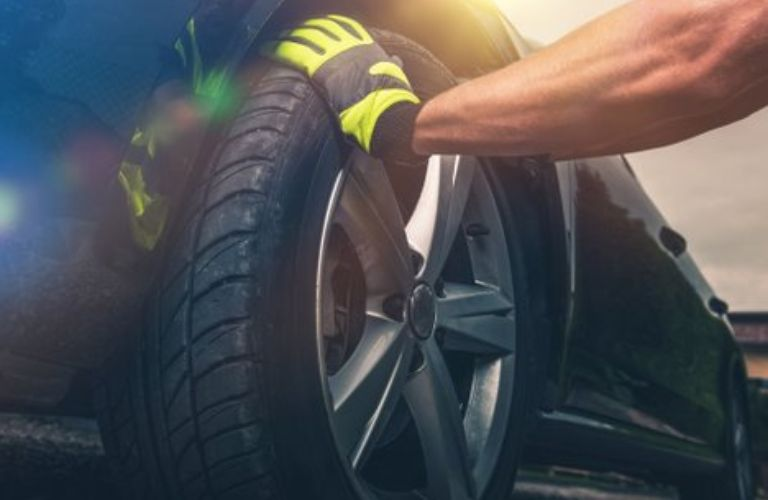 Mechanic working on the vehicle tire