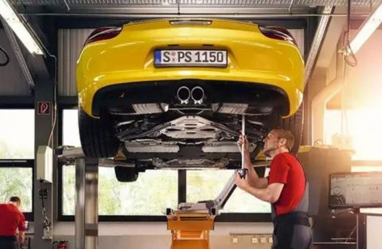 Service professional working on a vehicle