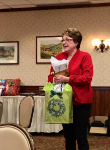 Linda Scaggs holding gifts