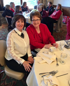 Linda Scaggs and a woman at a dinner smiling