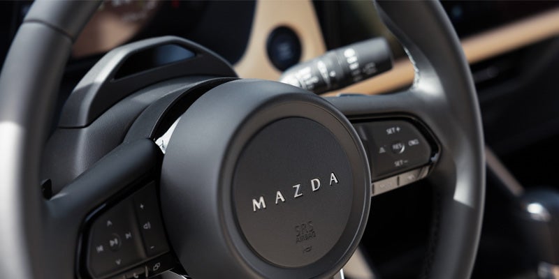 Mazda steering wheel with integrated controls.