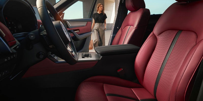 Red leather front seats in a Mazda SUV interior