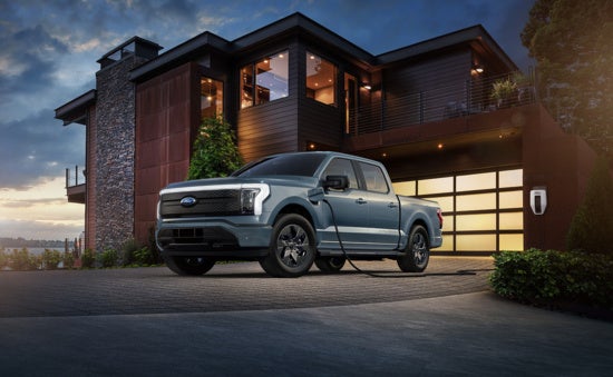  Ford F-150 Lightning electric pickup truck parked in front of building