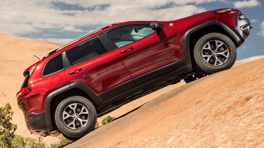 Jeep Grand Cherokee driving on sand dunes