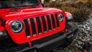 2018 Jeep Wrangler Rubicon crossing a rocky stream