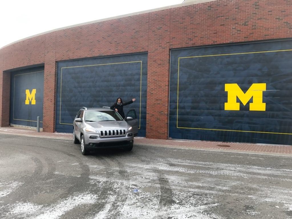 Jeep Cherokee parked outside an Eastern Michigan University building