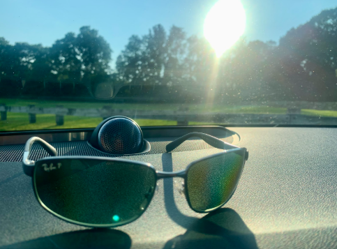 The film absorbs or reflects UV light before it ever reaches your skin or your car’s interior.