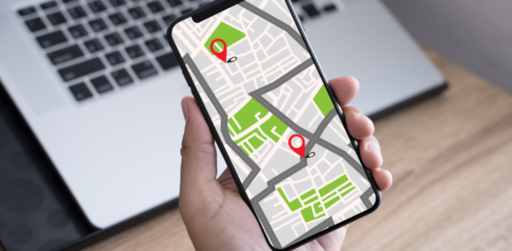 Hand holding smartphone with map navigation, relevant to Casino Escalator Accident Claims location tracking