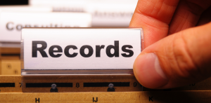 Close-up of a records file tab in a filing system, symbolizing organized document and records management