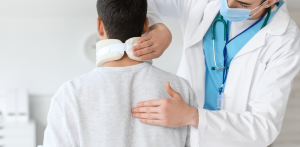 Doctor fits neck brace on injured patient, emphasizing post-crash care and pedestrian safety