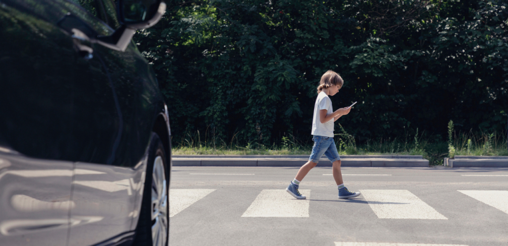 Child walking on a pedestrian crossing