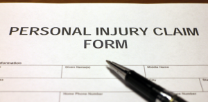 Close-up of personal injury claim form with pen, representing legal documentation for accident compensation