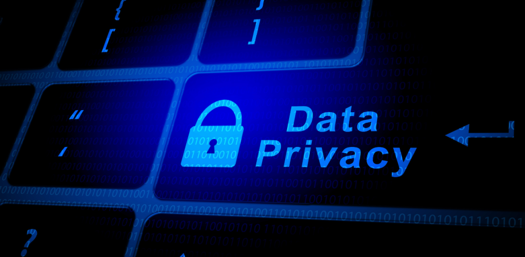 Glowing blue lock icon with “Data Privacy” text on a digital keyboard, symbolizing cybersecurity protection