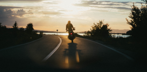 Motorcyclist Riding at Sunset