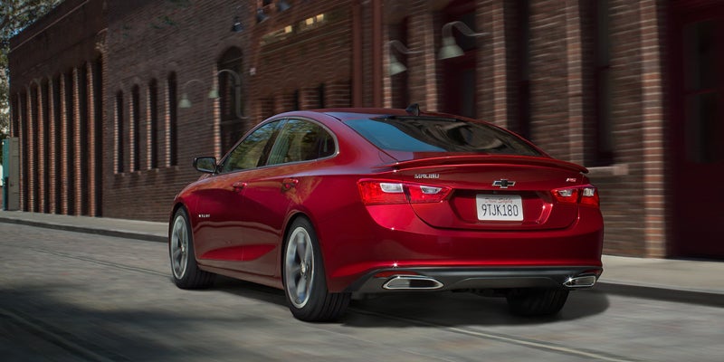 Red Chevrolet Malibu, rear three-quarter view